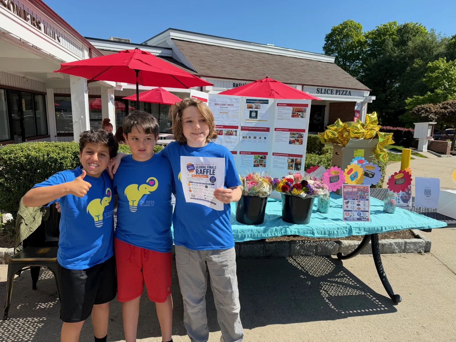 Fig. 9 — The team running a raffle table outside Bobo's Cafe in Somers