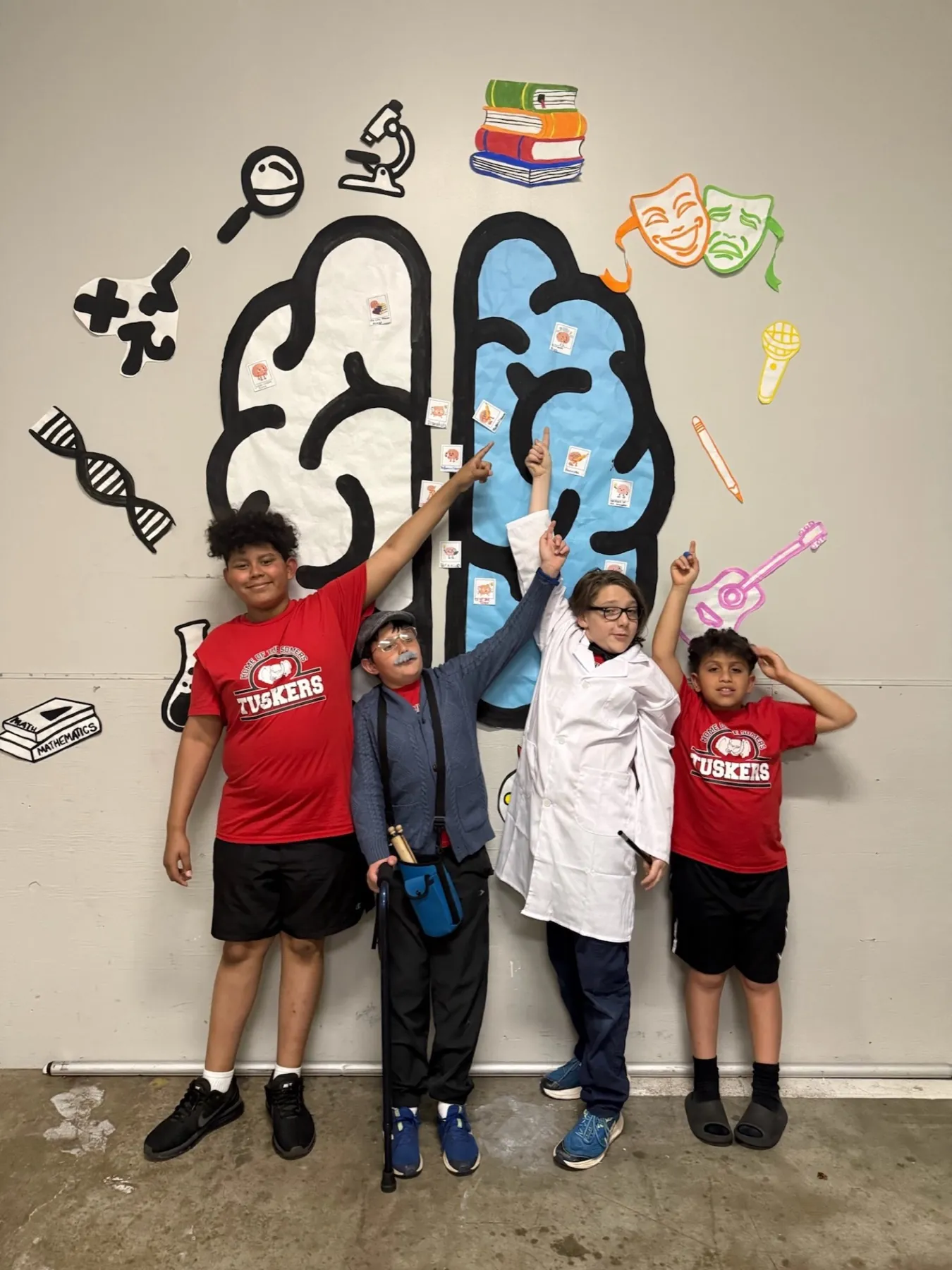 Fig. 3 — Team in costume in front of the brain wall installation at Global Finals