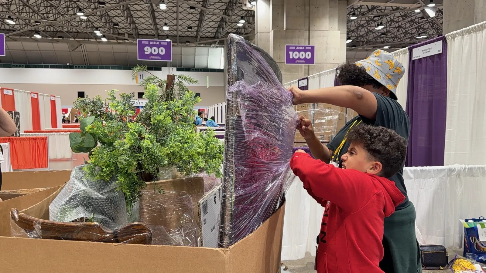 Fig. 7 — Unpacking the trees and props in the convention hall